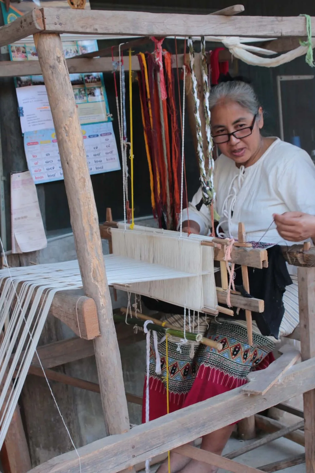 A local craftsperson working at a traditional loom